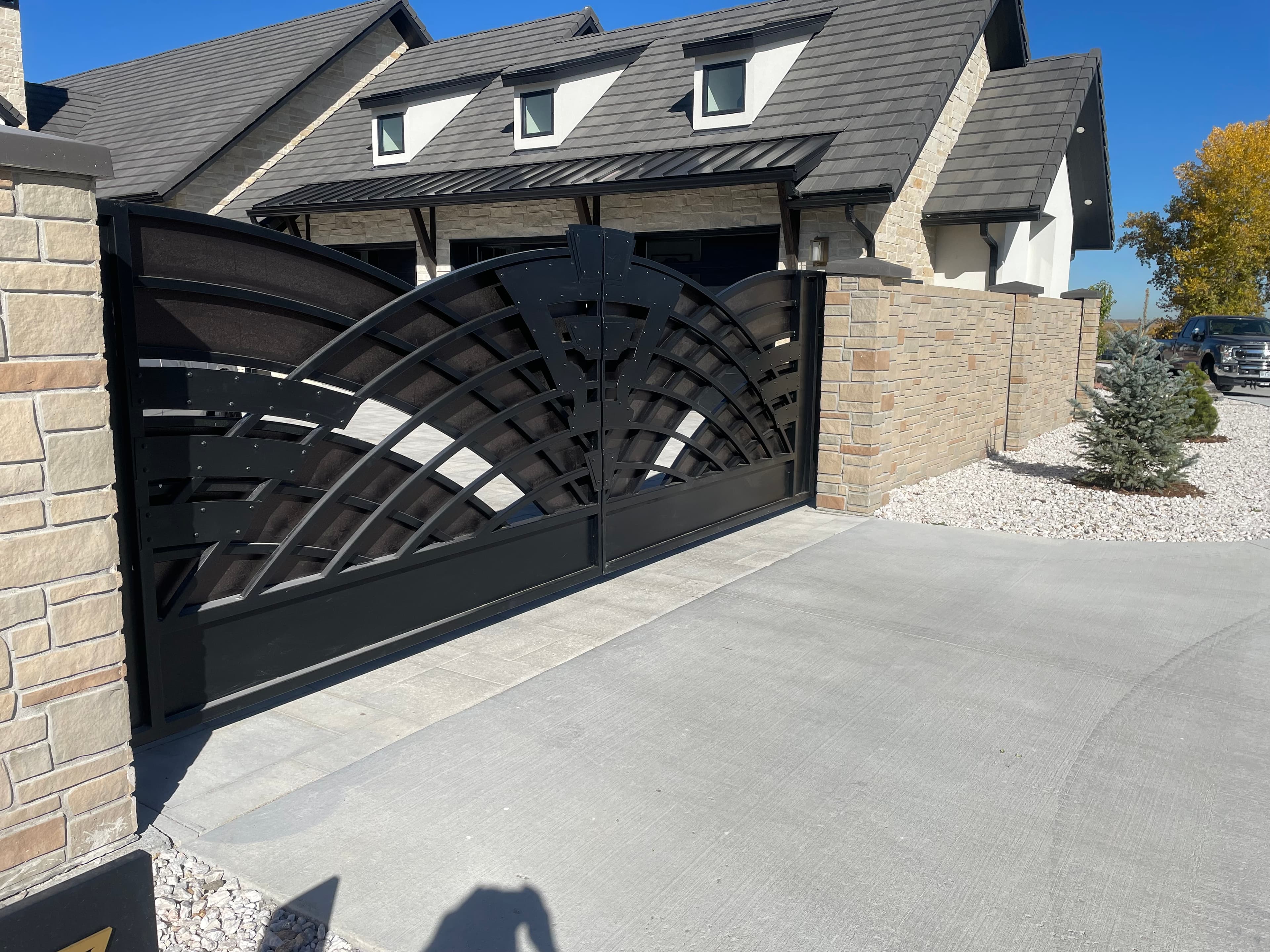 Bi-parting ornamental iron cantilever slide gates with HySecurity CNX operators in Longmont, CO