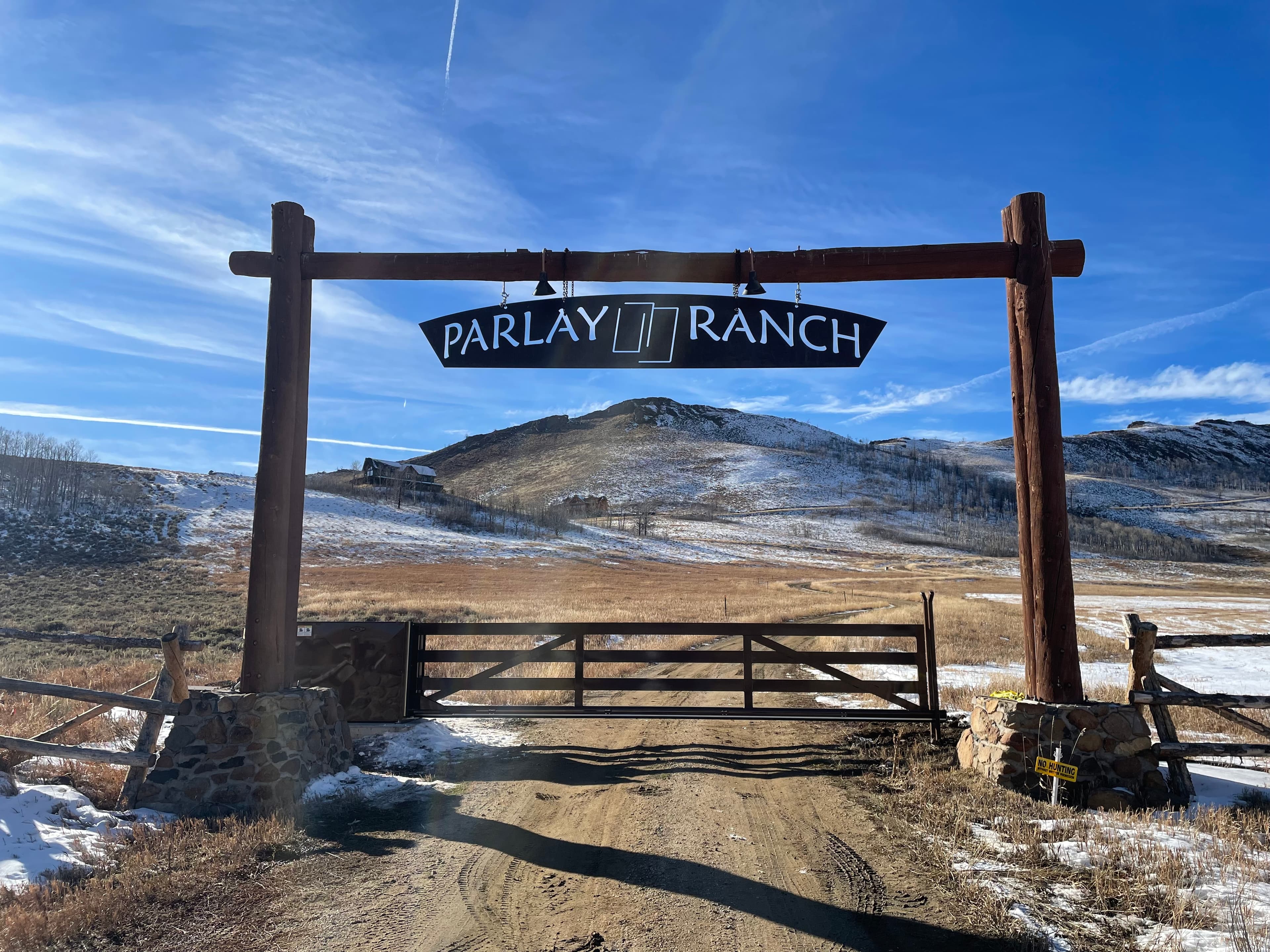 Vertical pivot ranch gate at Parlay Ranch in Granby, Colorado.